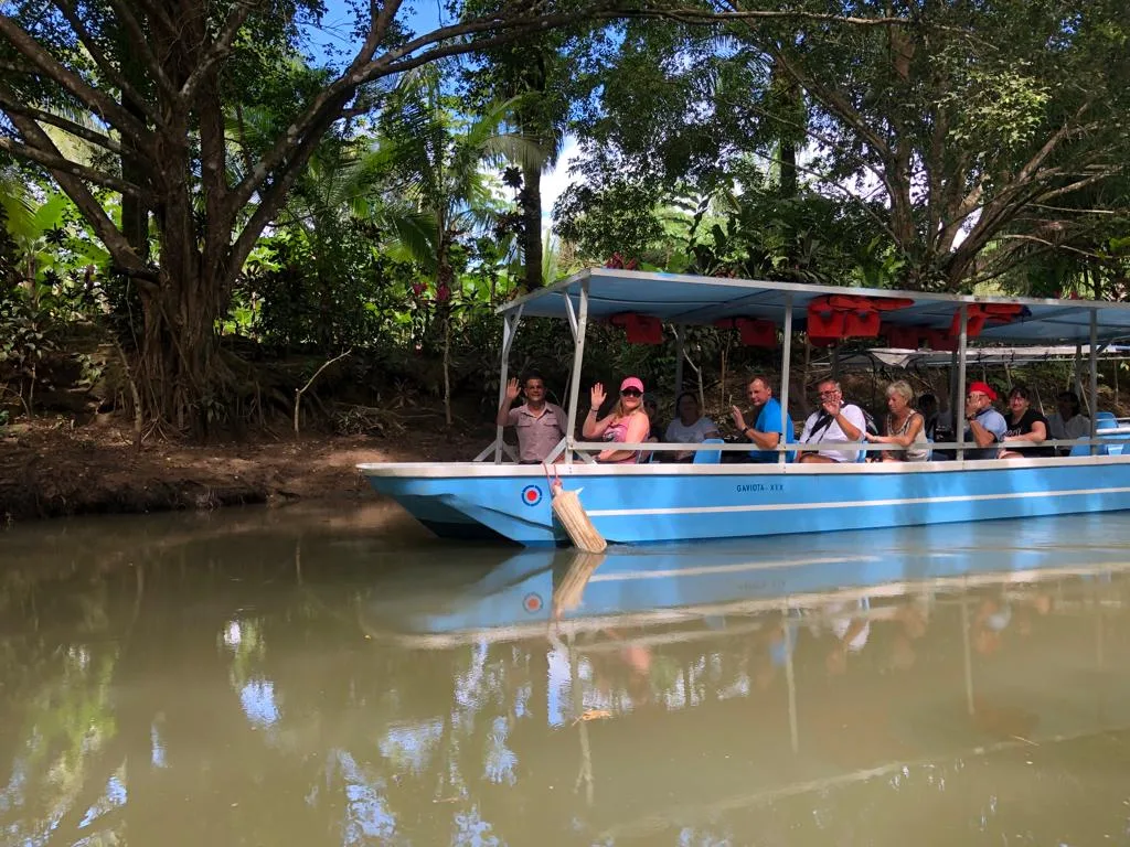 Guide with guests on a Manuel Antonio monkey boat tour, Damas Island, Costa Rica